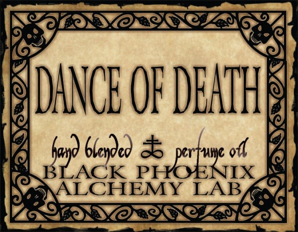 Label for 'Dance of Death' hand blended perfume oil by Black Phoenix Alchemy Lab with decorative border.