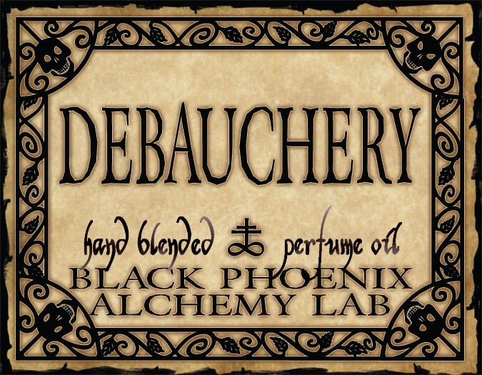 Label for 'Debauchery' hand blended perfume oil by Black Phoenix Alchemy Lab with decorative border.