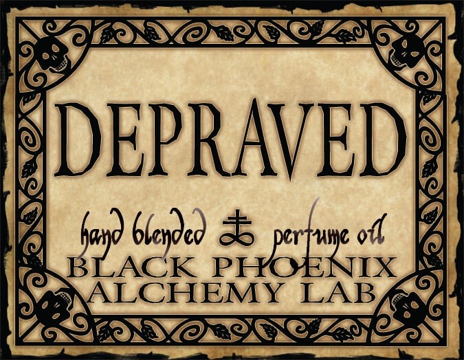 Label for 'Depraved' hand blended perfume oil by Black Phoenix Alchemy Lab with decorative border.
