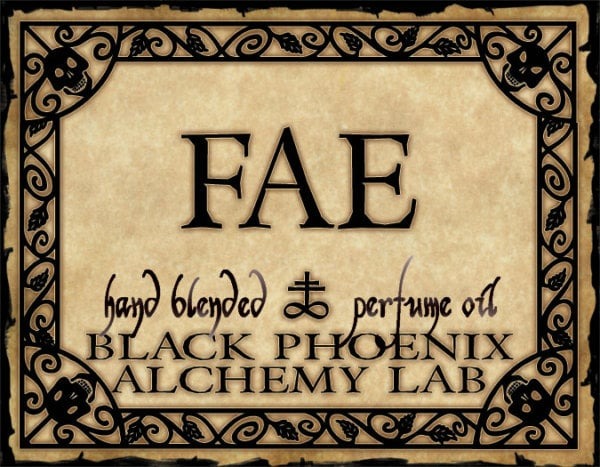 Label for 'FAE' hand blended perfume oil by Black Phoenix Alchemy Lab with decorative border.
