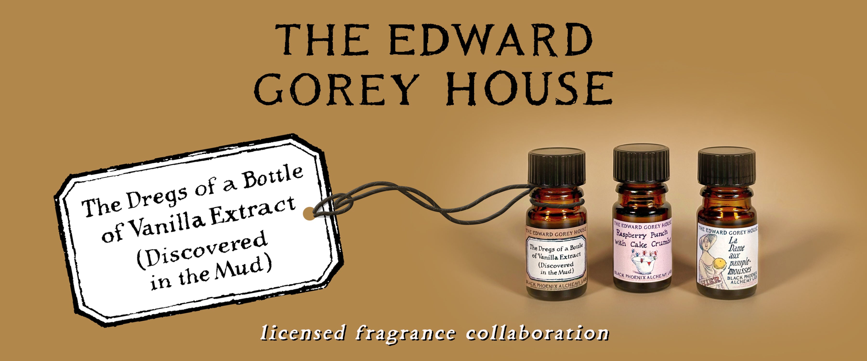 Three small bottles with labels on a brown background, featuring 'The Edward Gorey House' branding.