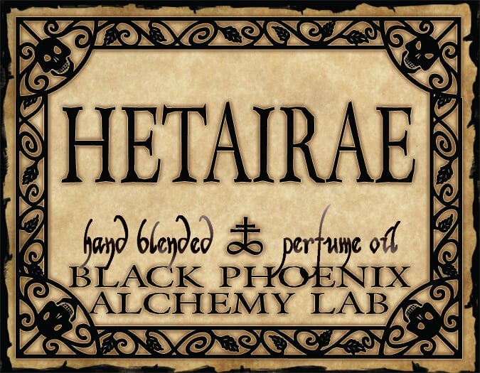Label for 'Hetairae' perfume oil by Black Phoenix Alchemy Lab with decorative border.