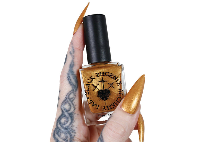 Black Phoenix Alchemy Lab Mead Moon claw polish swatch, gold microsparkle finish on nails