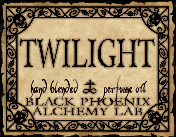 Label for 'Twilight' hand blended perfume oil by Black Phoenix Alchemy Lab with decorative border.