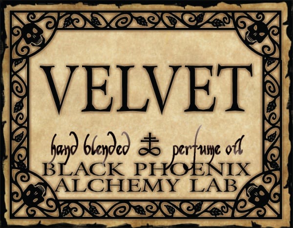 Label for 'Velvet' hand blended perfume oil by Black Phoenix Alchemy Lab with decorative border.