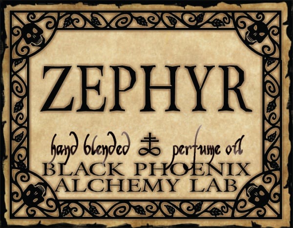 Label for Zephyr hand blended perfume oil by Black Phoenix Alchemy Lab with decorative border.