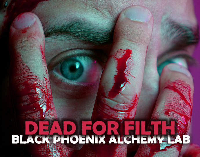 Close-up of a person with blood-stained fingers and text &