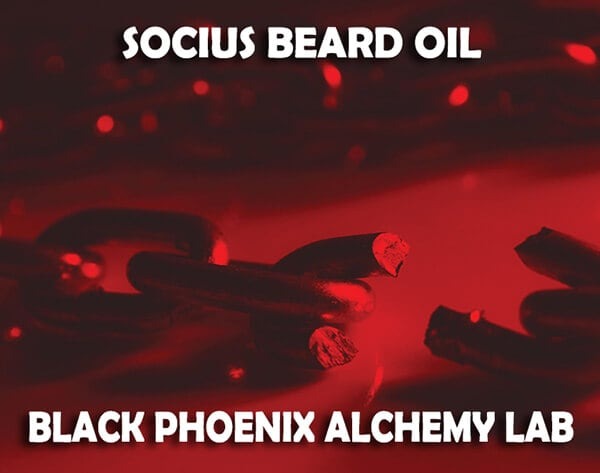 Beard oil with 'Socius Beard Oil' and 'Black Phoenix Alchemy Lab' text on a red background.
