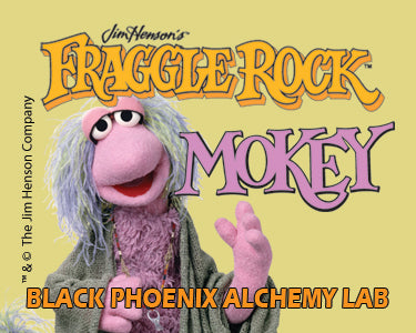 Fraggle Rock character Mokey with a yellow background and text.