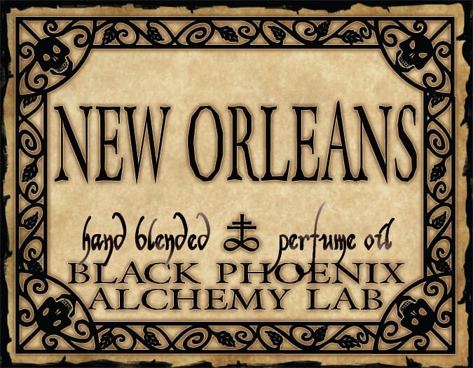 Label for New Orleans hand blended perfume oil by Black Phoenix Alchemy Lab with decorative border.