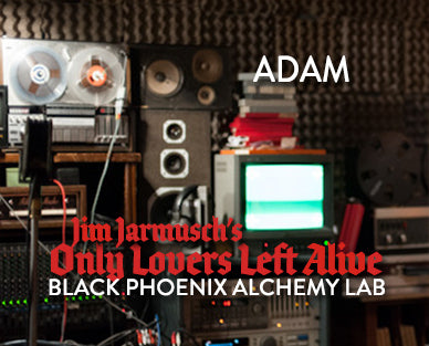 Vintage audio equipment with 'Adam' and text overlay in a dark setting