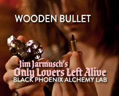 Wooden bullet prop with text overlay for &