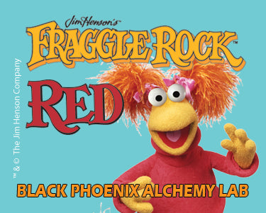 Character from 'Fraggle Rock' with a blue background and text about 'Black Phoenix Alchemy Lab'.