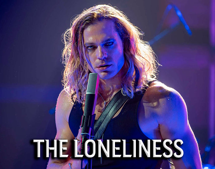 The Loneliness title card — Lestat de Lioncourt at the microphone under purple stage lights — The Vampire Lestat x AMC, Interview with the Vampire Season 3
