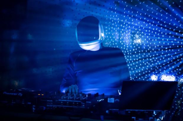  Masked vampire DJ under blue lasers at a nightclub — The Vampire Lestat x AMC, Interview with the Vampire Season 3
