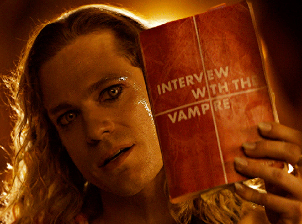 Lestat holding the Interview with the Vampire book while singing to Louis — The Vampire Lestat x AMC, Interview with the Vampire Season 3
