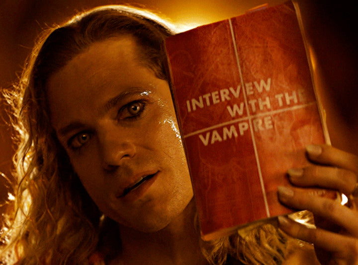 Lestat holding the Interview with the Vampire book while singing to Louis — The Vampire Lestat x AMC, Interview with the Vampire Season 3
