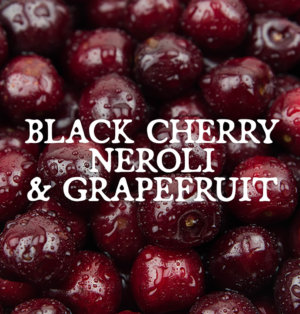 Decorative image for Black Cherry, Neroli, and Grapefruit, text against a background of cherries