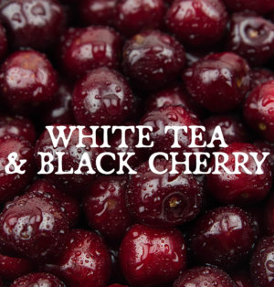 Decorative image for White Tea and Black Cherry, text against a background of cherries