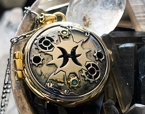 photograph of BPAL's Pisces steampunk astrological scent locket